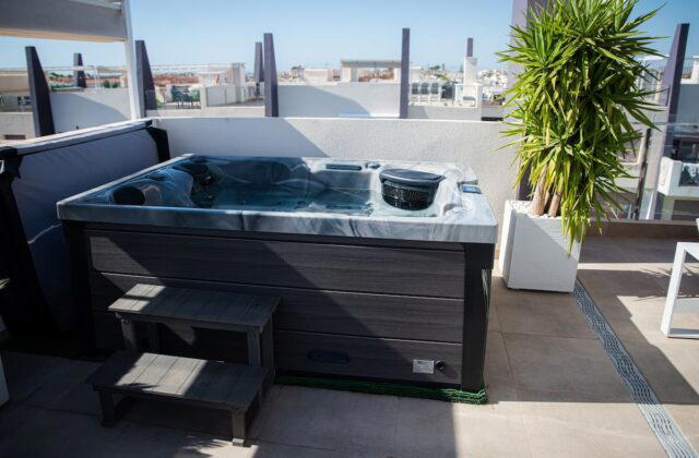 A Platinum Spas Topaz hot tub in Odyssey, on a rooftop terrace.