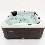 Platinum Spas Happy hot tub front studio shot with water filled and jets visible