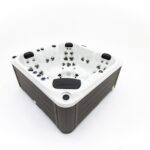 Platinum Spas Happy hot tub corner studio shot showing dark wood-effect cabinet