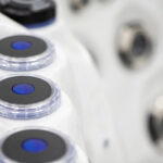 Platinum Spas Palma hot tub macro view of illuminated blue LED jet nozzles