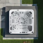 Overhead view of a Platinum Spas Palma hot tub on a paved patio