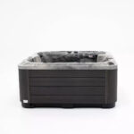 Platinum Spas Refresh hot tub in dark marbled acrylic with a charcoal cabinet, front view