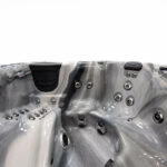 Close-up of Platinum Spas Refresh hot tub seating showing headrests, jets and seat pressure controls