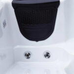 Padded headrest above hydrotherapy jets in the lounger seat of a Platinum Spas Reims hot tub