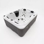 Platinum Spas Tahiti hot tub in Sterling Silver acrylic showing the control panel on the corner rim