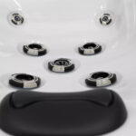 Platinum Spas Tahiti hot tub corner control button beside headrests with water running