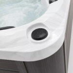Platinum Spas Tahiti hot tub drain cover fitted into the corner of the acrylic shell