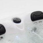 Platinum Spas Tahiti hot tub filtration intake grille set into the corner of the shell