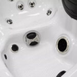 Platinum Spas Tahiti hot tub jets and headrest fitted along the seating edge