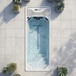 Platinum Spas Chronos mini pool overhead view sunk into a paved patio with potted plants around the surround