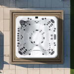 Overhead view of a Platinum Spas Oslo hot tub on a paved patio