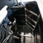 Steel support frame and pump inside the cabinet of a Platinum Spas mini pool