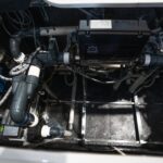 Equipment bay of a Platinum Spas mini pool showing the pumps, pipework and control box