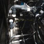 Pump and pipework inside the equipment bay of a Platinum Spas mini pool