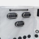 Three swim jets below a grab rail on the end wall of a Platinum Spas mini pool