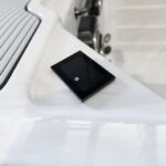 Touchscreen control pad set into the acrylic rim of a Platinum Spas mini pool