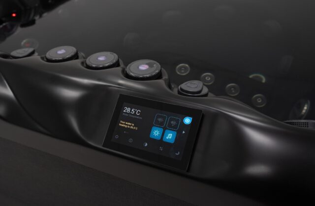 SpaTouch touchscreen control panel on a Platinum Spas Positano hot tub showing water temperature and settings