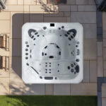 Overhead view of a Platinum Spas Santorini hot tub on a paved patio