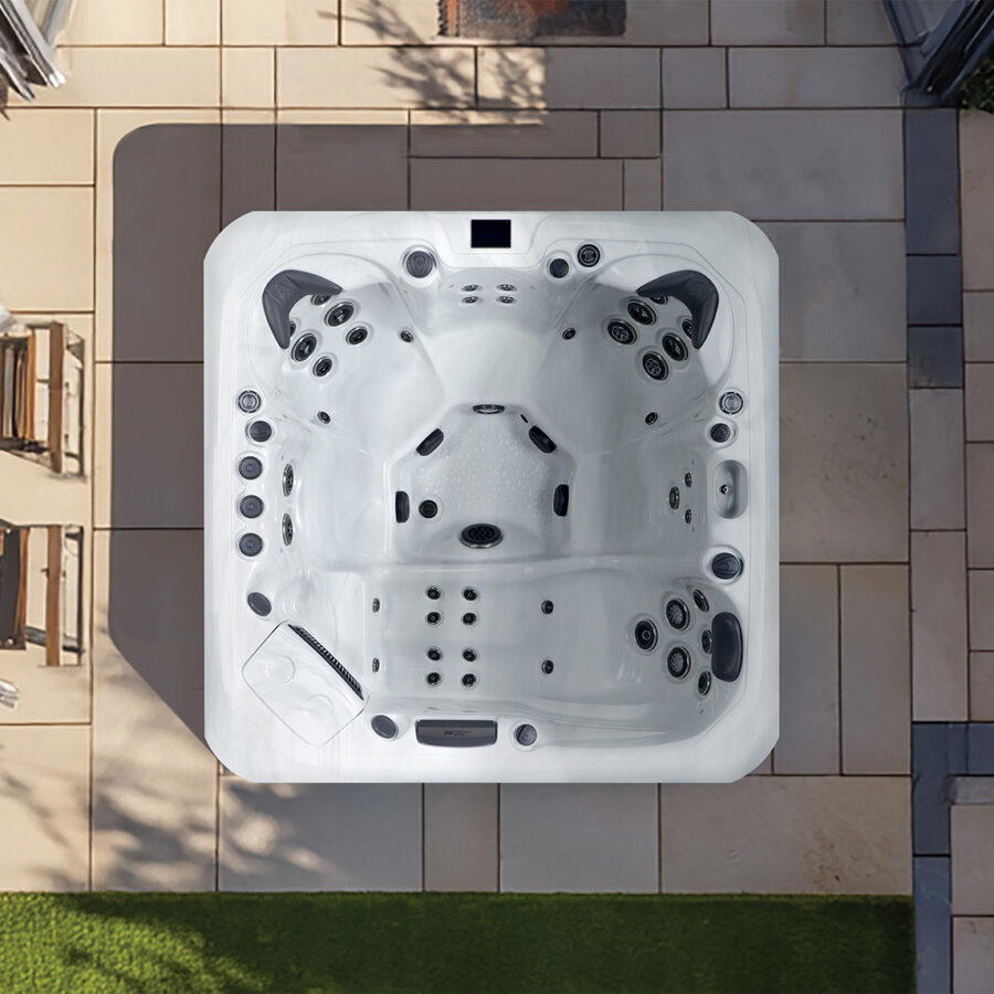 Overhead view of a Platinum Spas Santorini hot tub on a paved patio