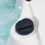 Platinum Spas Titan swim spa close-up of the jet flow control button on the cabinet rim
