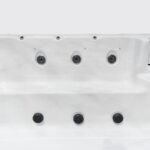 Platinum Spas Titan swim spa empty interior close-up showing rows of hydrotherapy jets along the wall