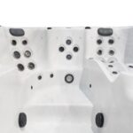 Platinum Spas Titan swim spa empty interior showing the seating layout with jets and control panel
