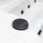 Platinum Spas Titan swim spa close-up of the built-in speaker grille set into the cabinet rim