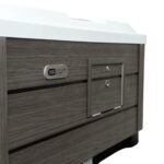 Platinum Spas Vacation Retreat hot tub cabinet panel showing the brand badge and lockable service hatch with hinges