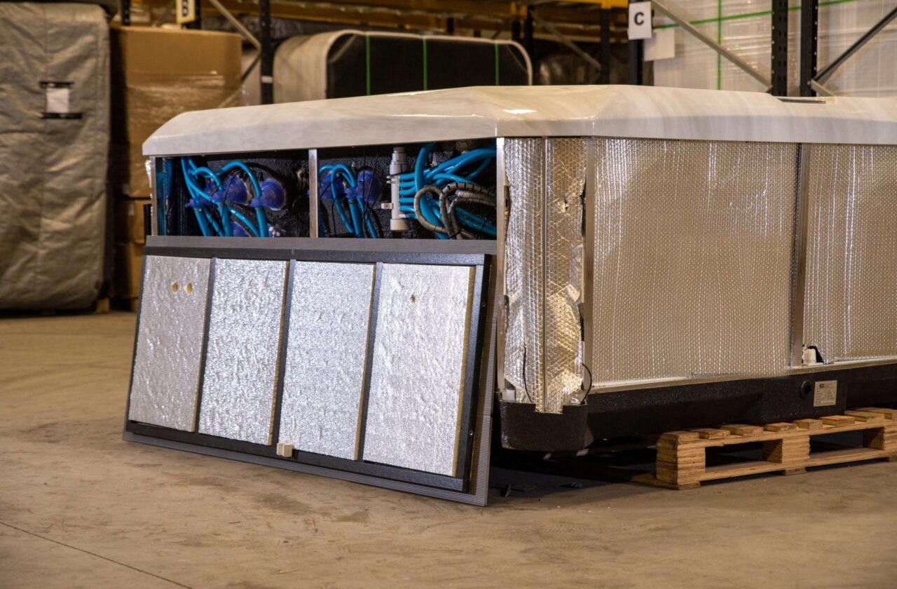 Platinum Premium Shield insulation: foil wrapped cabinet panels and insulated side boards on a Platinum Spas hot tub in the factory