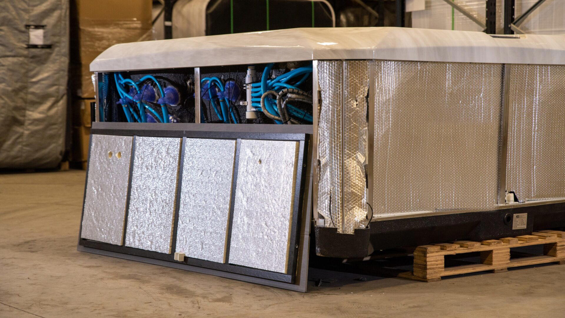 Platinum Premium Shield insulation: foil wrapped cabinet panels and insulated side boards on a Platinum Spas hot tub in the factory